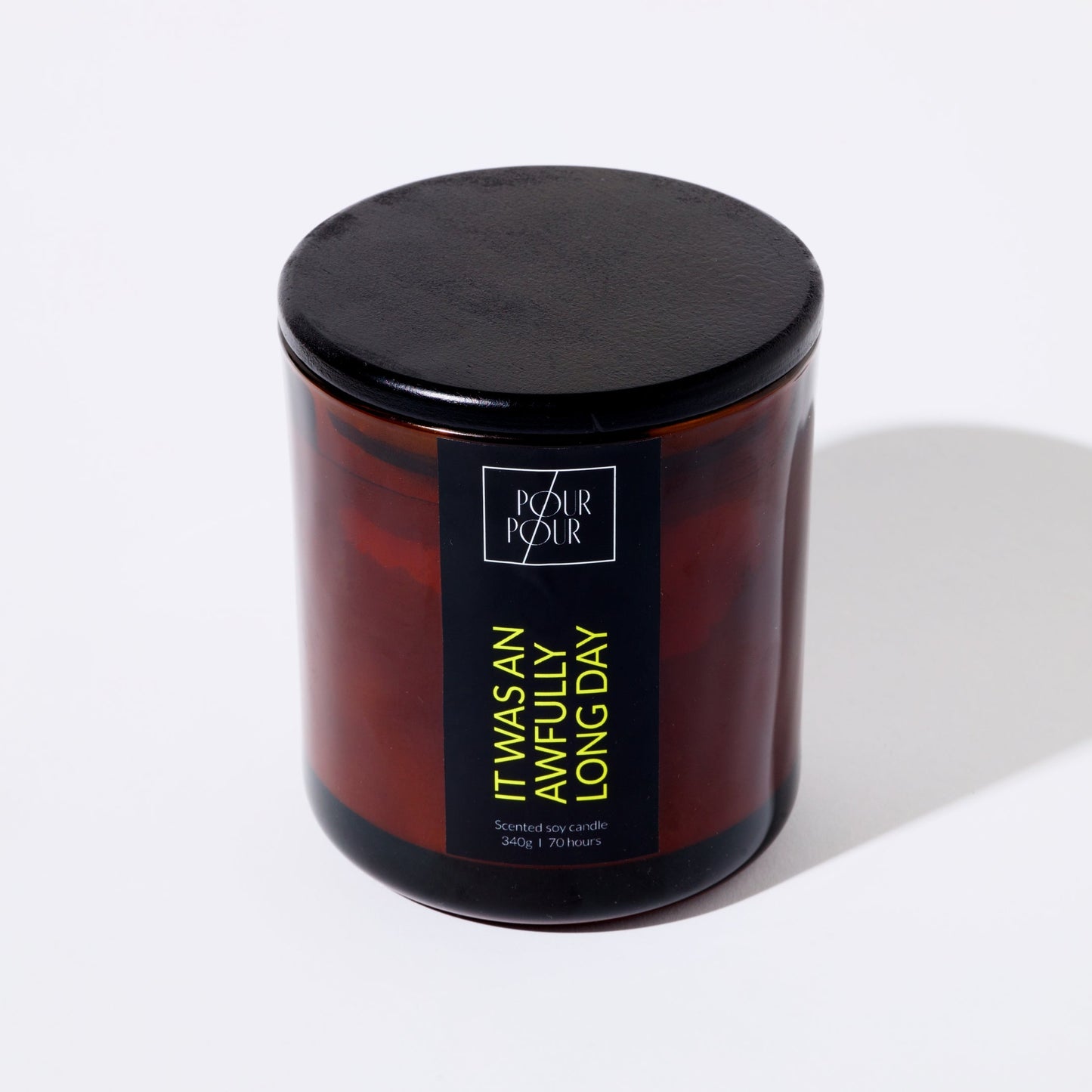 Candle jar with a black lid and label on a white background